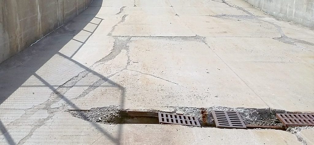 Damaged commercial/retail concrete sidewalk